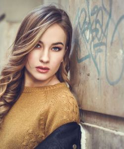 Beautiful blonde russian woman in urban background
